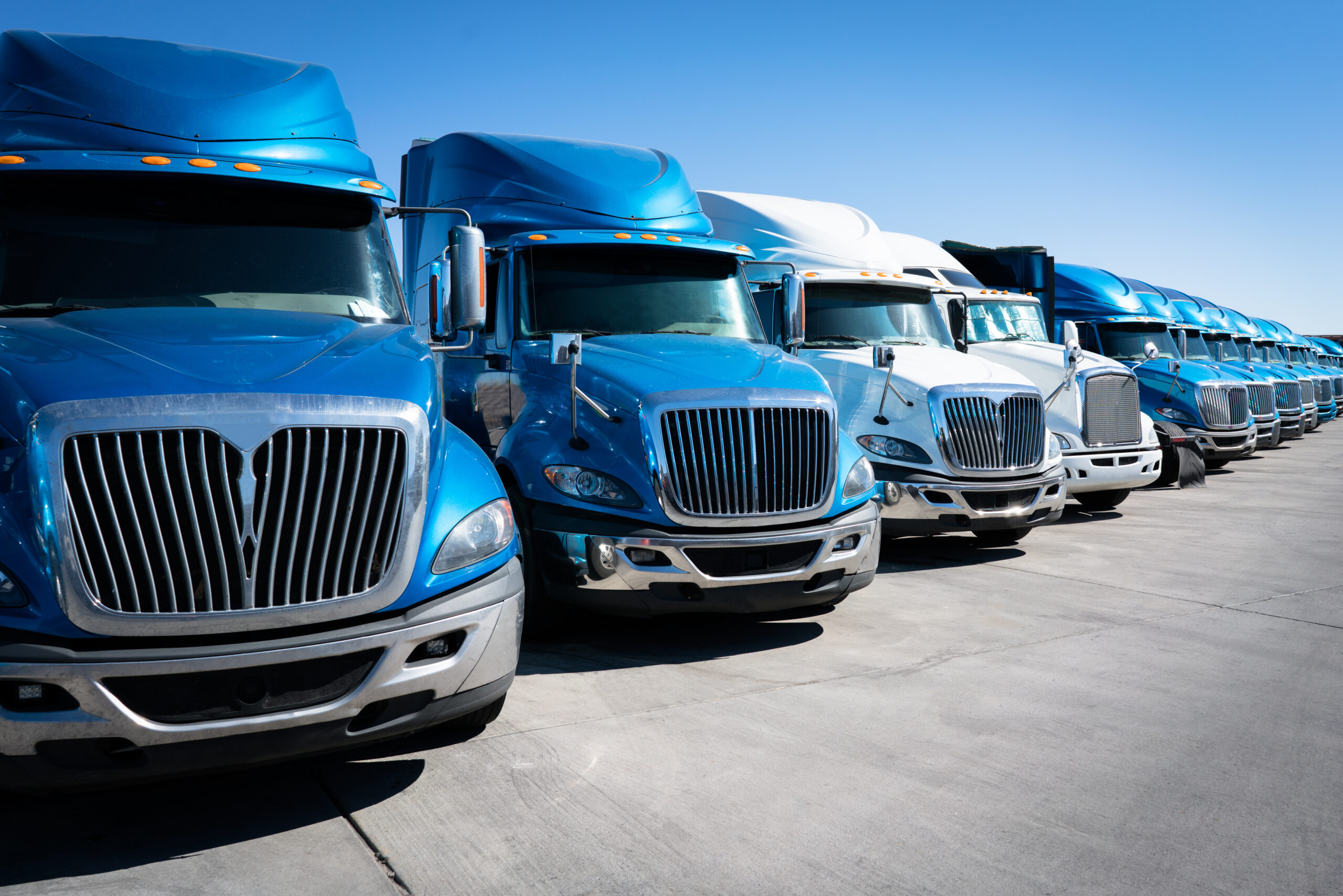 Fleet of blue 18 wheelers