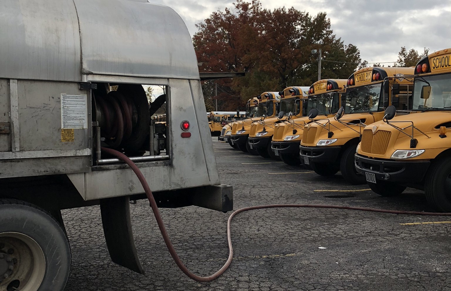 Image of a tank wethosing a fleet of school buses
