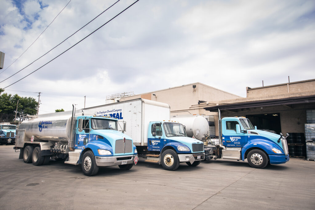 Image of several Universal Oil trucks in front of one of our buildings