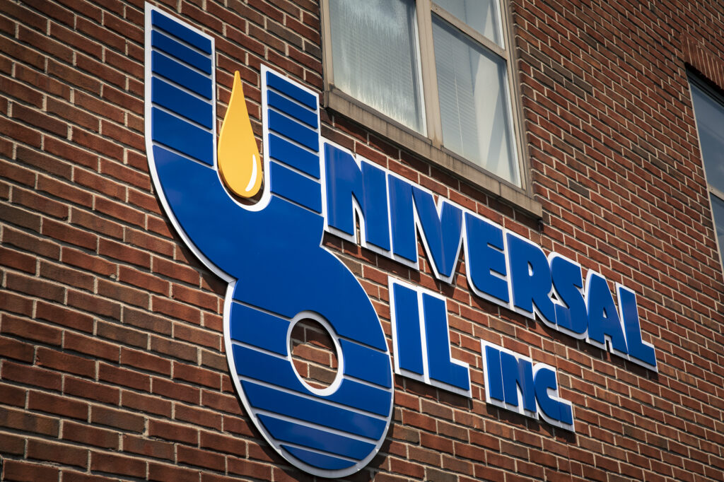 Image of the Universal Oil logo on the side of our office building.
